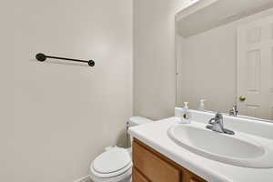 Bathroom with vanity and toilet