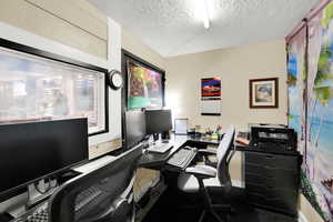 Office area with a textured ceiling