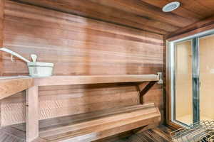 Relaxing sauna / steam room with wooden ceiling and wooden walls