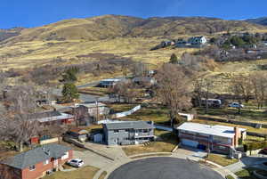 Aerial view of residential area with a mountain backdrop