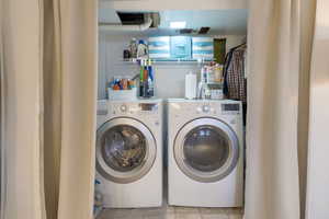 Laundry area with included washer and dryer