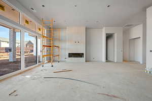 Unfurnished living room with a large fireplace