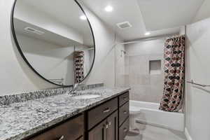 Upgraded granite tops and tile shower surround!