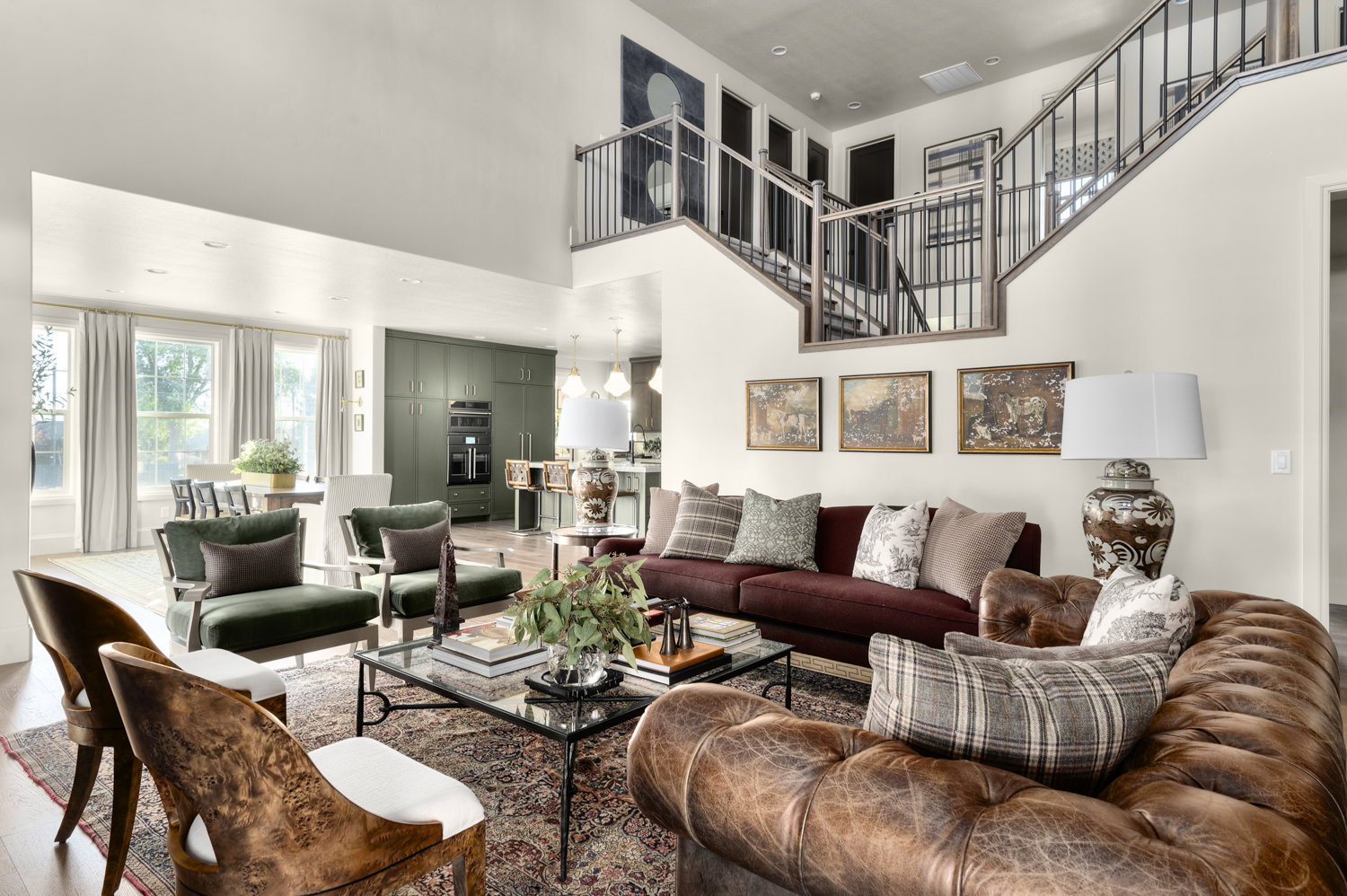Living room featuring a high ceiling and wood finished floors