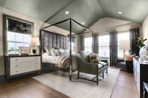 Bedroom with light wood-type flooring and a textured ceiling