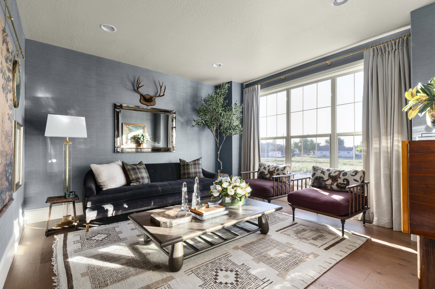 Living room with hardwood / wood-style floors and recessed lighting