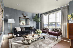 Living room with hardwood / wood-style floors and recessed lighting