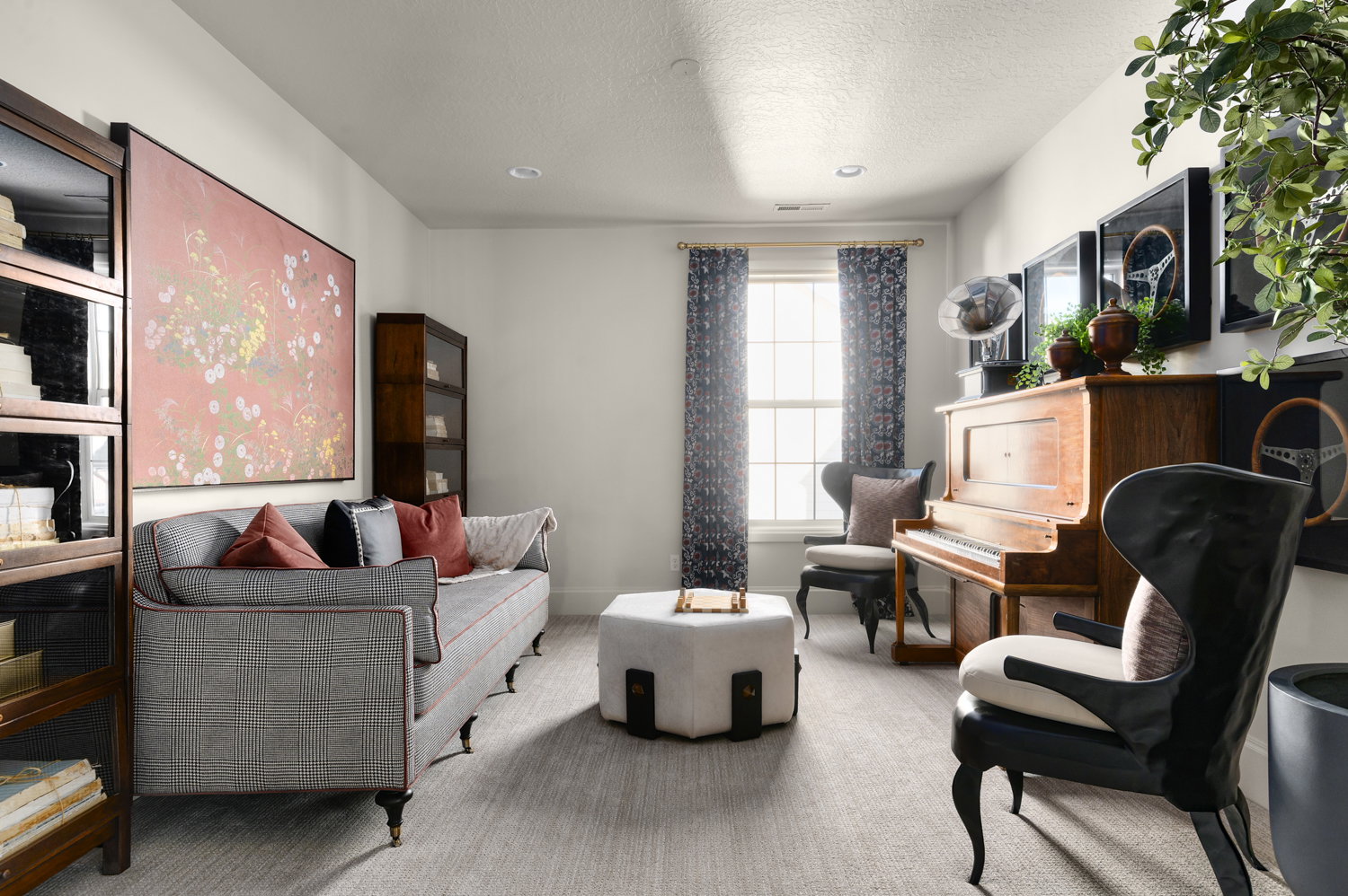 Sitting room featuring carpet and a textured ceiling