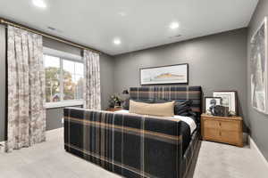 Bedroom featuring light carpet and recessed lighting