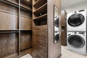Laundry area with stacked washer / drying machine