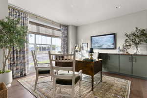 Office space featuring wood finished floors and recessed lighting