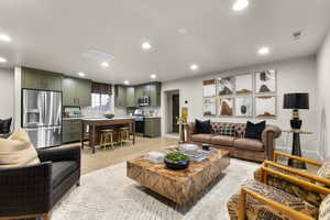 Living room featuring light wood-style floors and recessed lighting