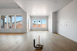 Unfurnished living room with light wood-type flooring