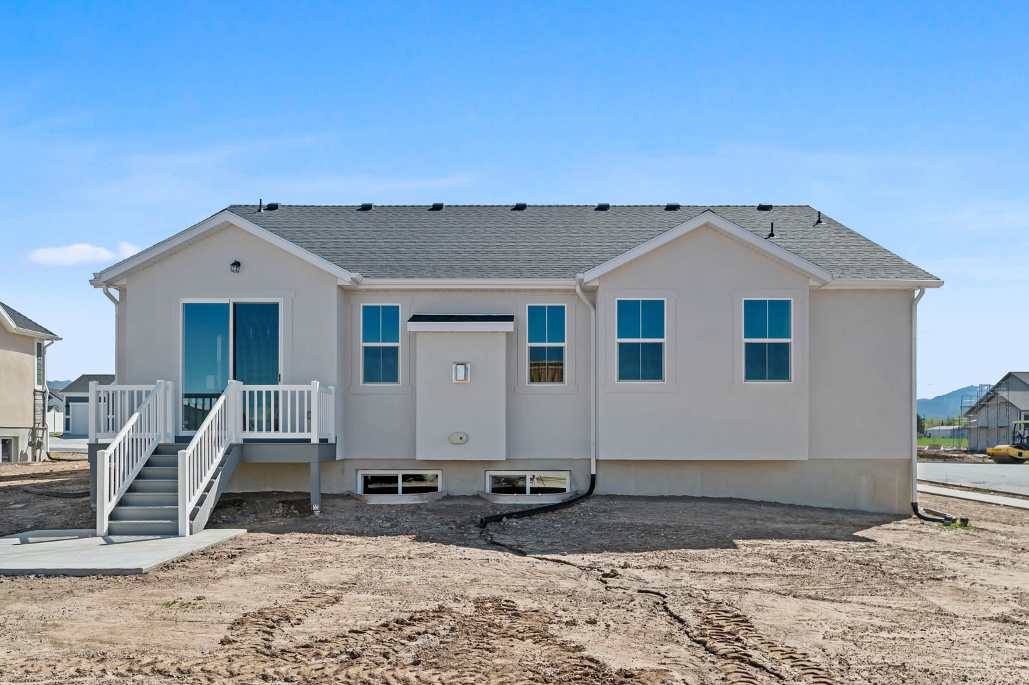 Back of property with a shingled roof