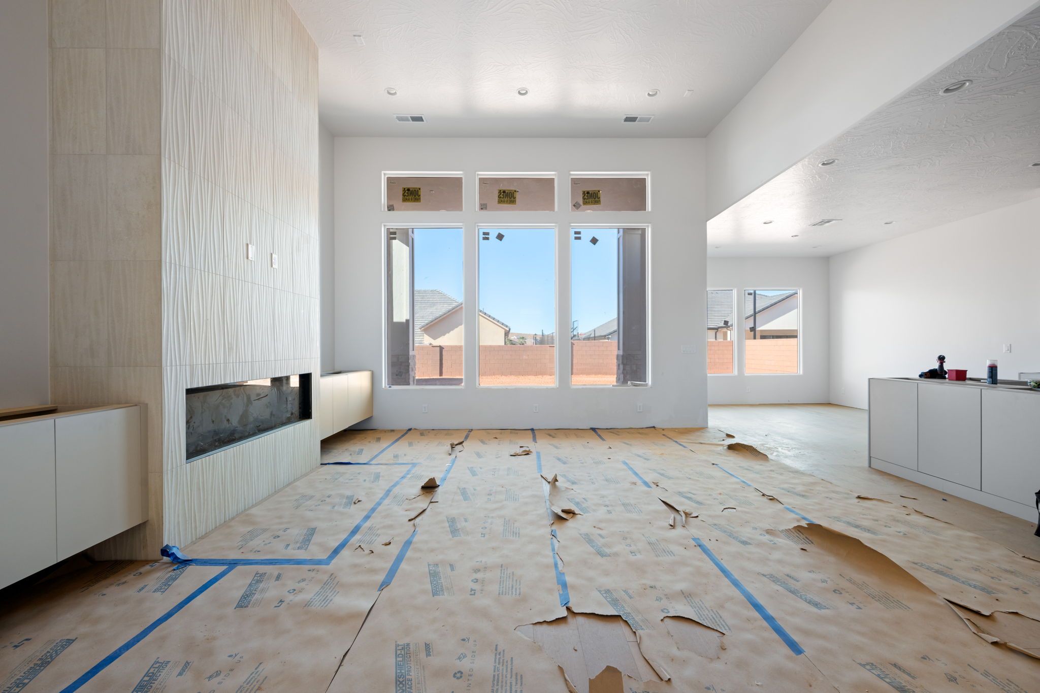 Unfurnished living room with a large fireplace