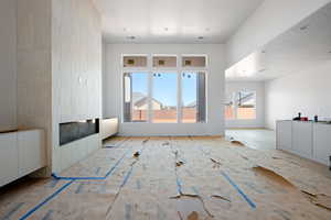 Unfurnished living room with a large fireplace
