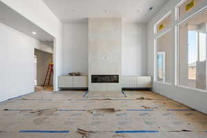 Living room with a fireplace and recessed lighting