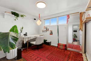 Office area featuring wood finished floors