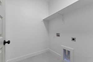 Laundry area with washer hookup and hookup for an electric dryer