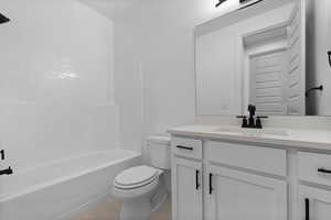 Full bath with vanity and tub / shower combination