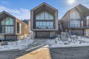 Contemporary home featuring an attached garage and a balcony