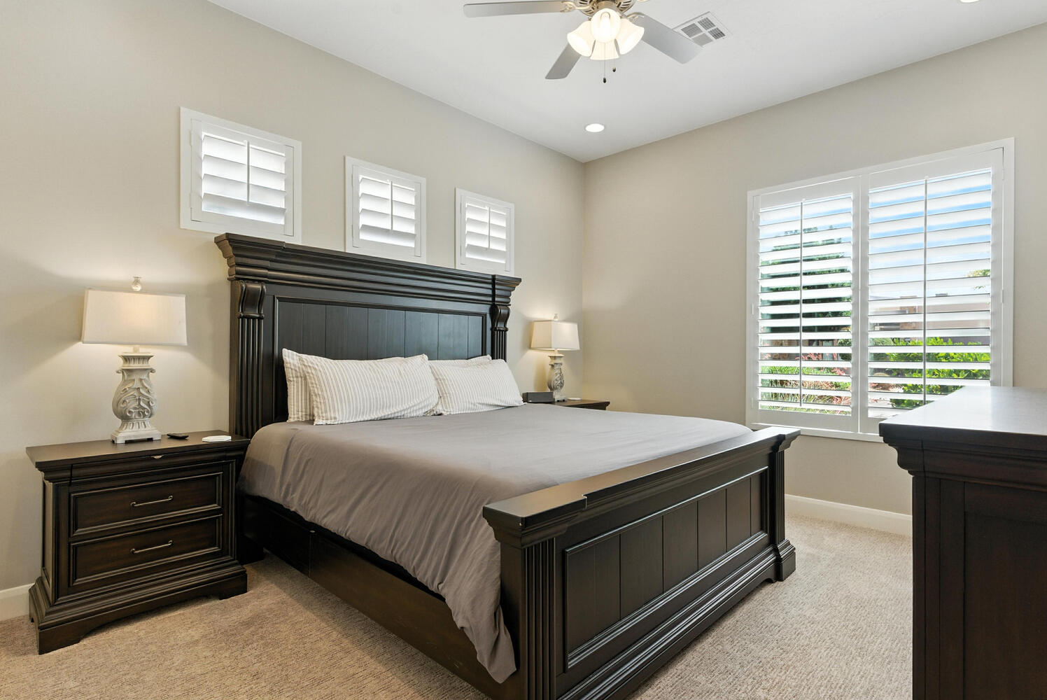 Bedroom featuring light colored carpet, ceiling fan, and recessed lighting