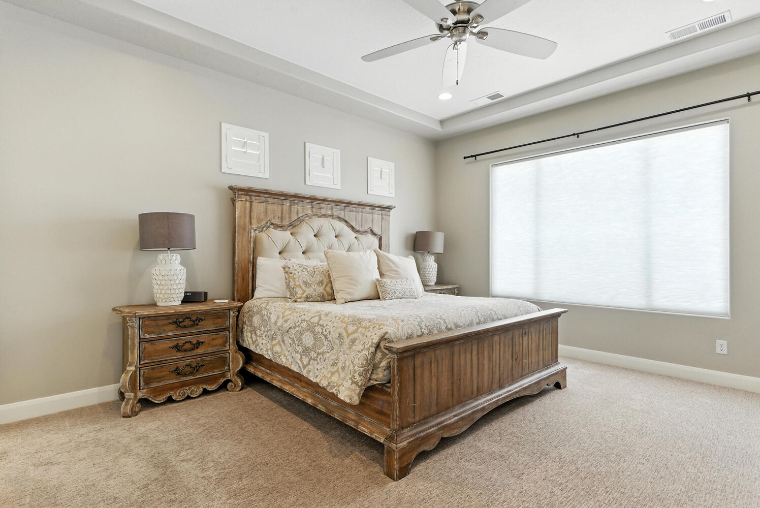Bedroom featuring ceiling fan and light carpet