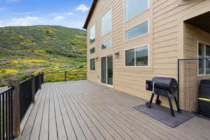 Wooden terrace with a grill