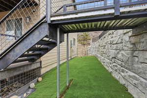 View of yard featuring stairway
