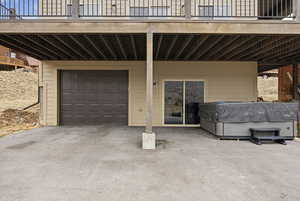 Garage featuring asphalt driveway