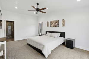 Bedroom featuring recessed lighting, carpet flooring, ceiling fan, and lofted ceiling