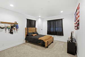 Bedroom featuring light colored carpet and recessed lighting