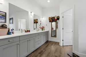 Full bathroom featuring vanity and dark wood finished floors