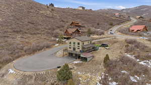 Aerial overview of property's location with a mountainous background
