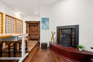Bar with dark wood-style flooring, recessed lighting, and wood counters