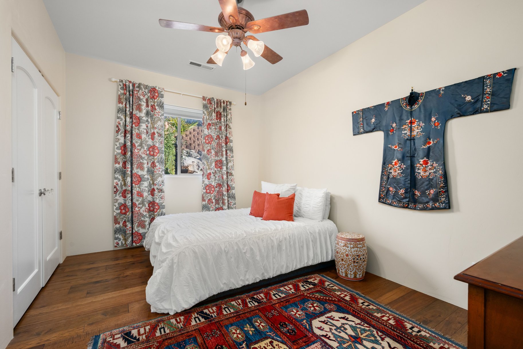 Bedroom featuring a closet, a ceiling fan, and wood-type flooring