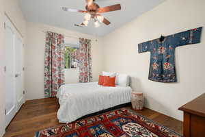 Bedroom featuring a closet, a ceiling fan, and wood-type flooring