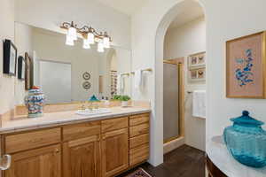 Bathroom with vanity and a shower stall