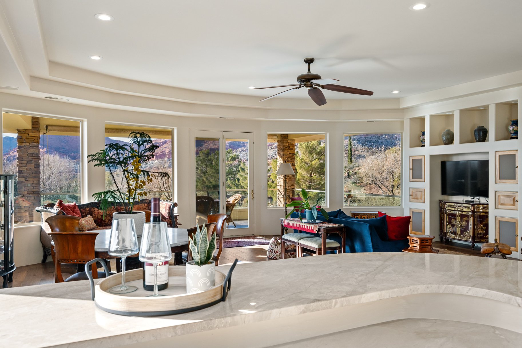 Living room featuring a ceiling fan, wood finished floors, and recessed lighting