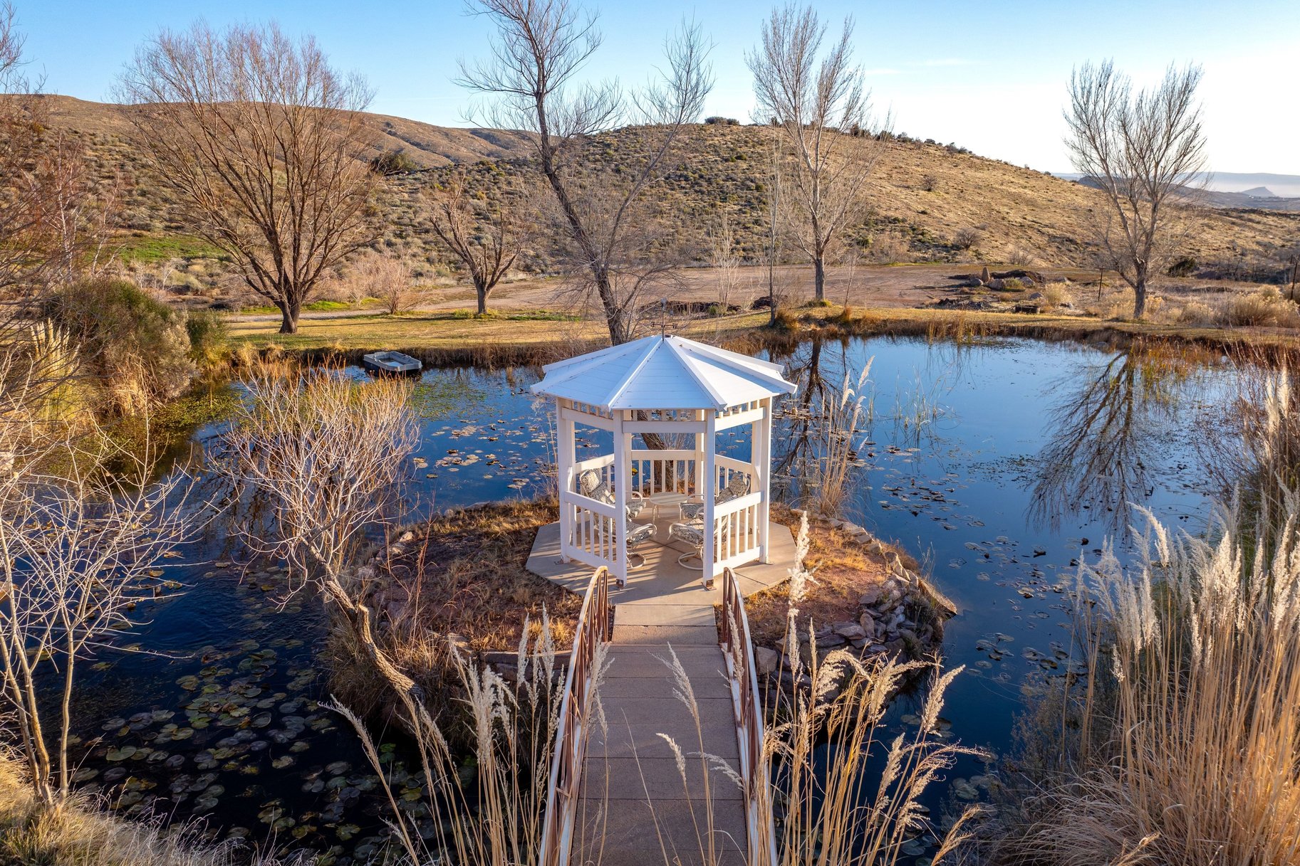 Dock featuring a water and mountain view and a gazebo