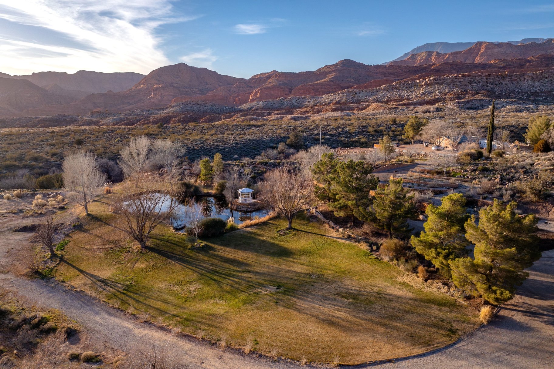 Aerial view of property's location featuring a mountain backdrop and rural landscape