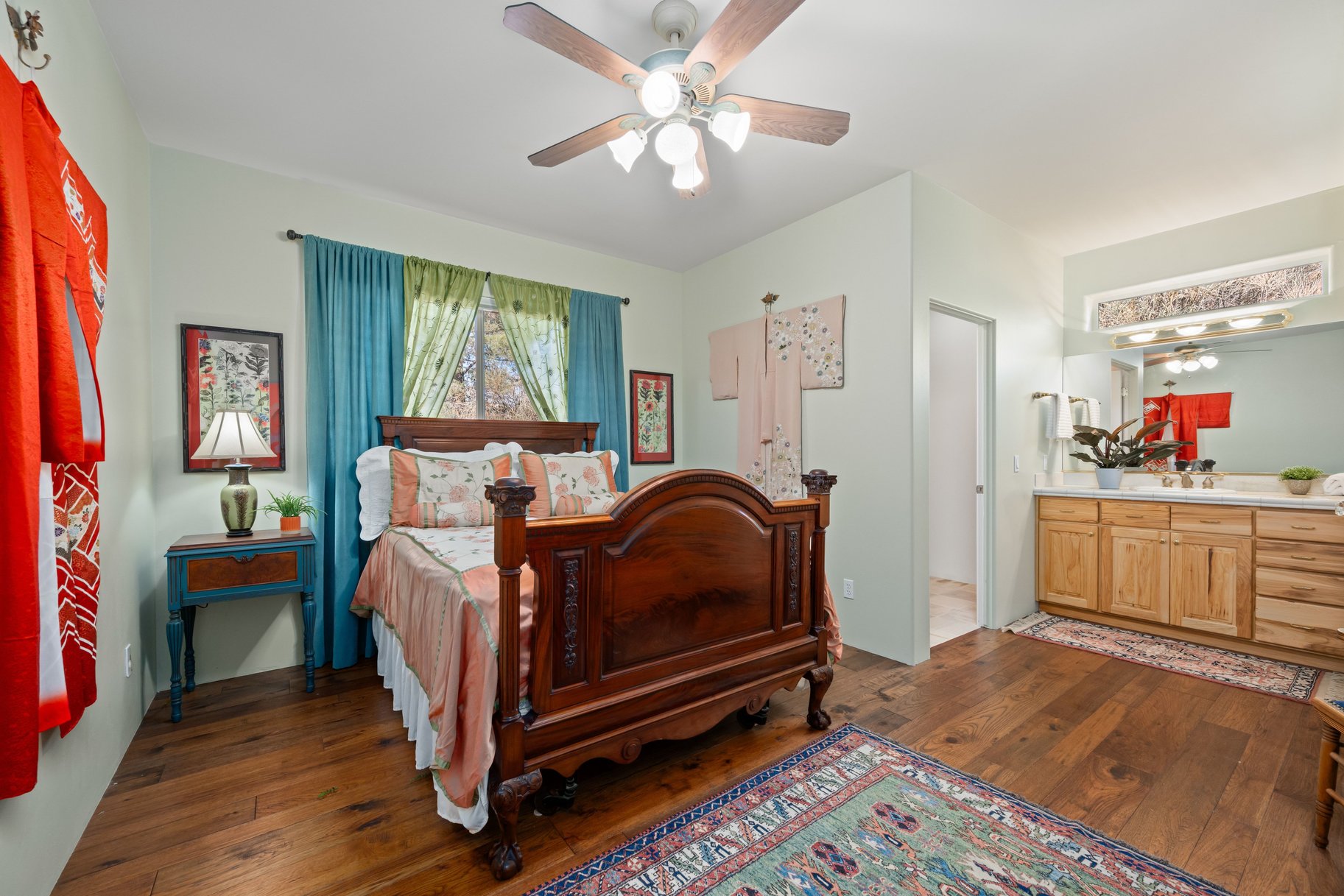 Bedroom featuring dark wood-style flooring and ceiling fan