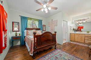 Bedroom featuring dark wood-style flooring and ceiling fan