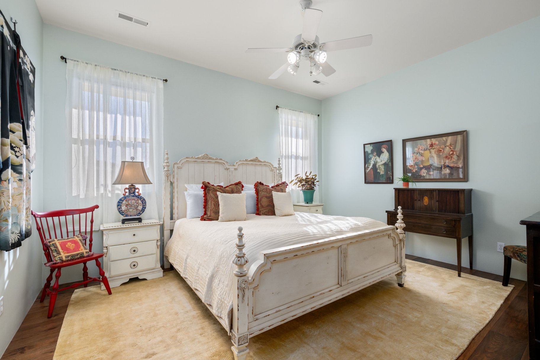 Bedroom featuring wood finished floors and ceiling fan