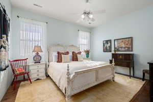 Bedroom featuring wood finished floors and ceiling fan