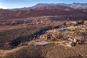 View of mountain backdrop featuring a desert landscape