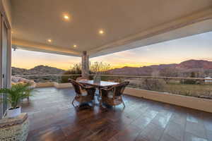 View of patio / terrace with a mountain view and outdoor dining space