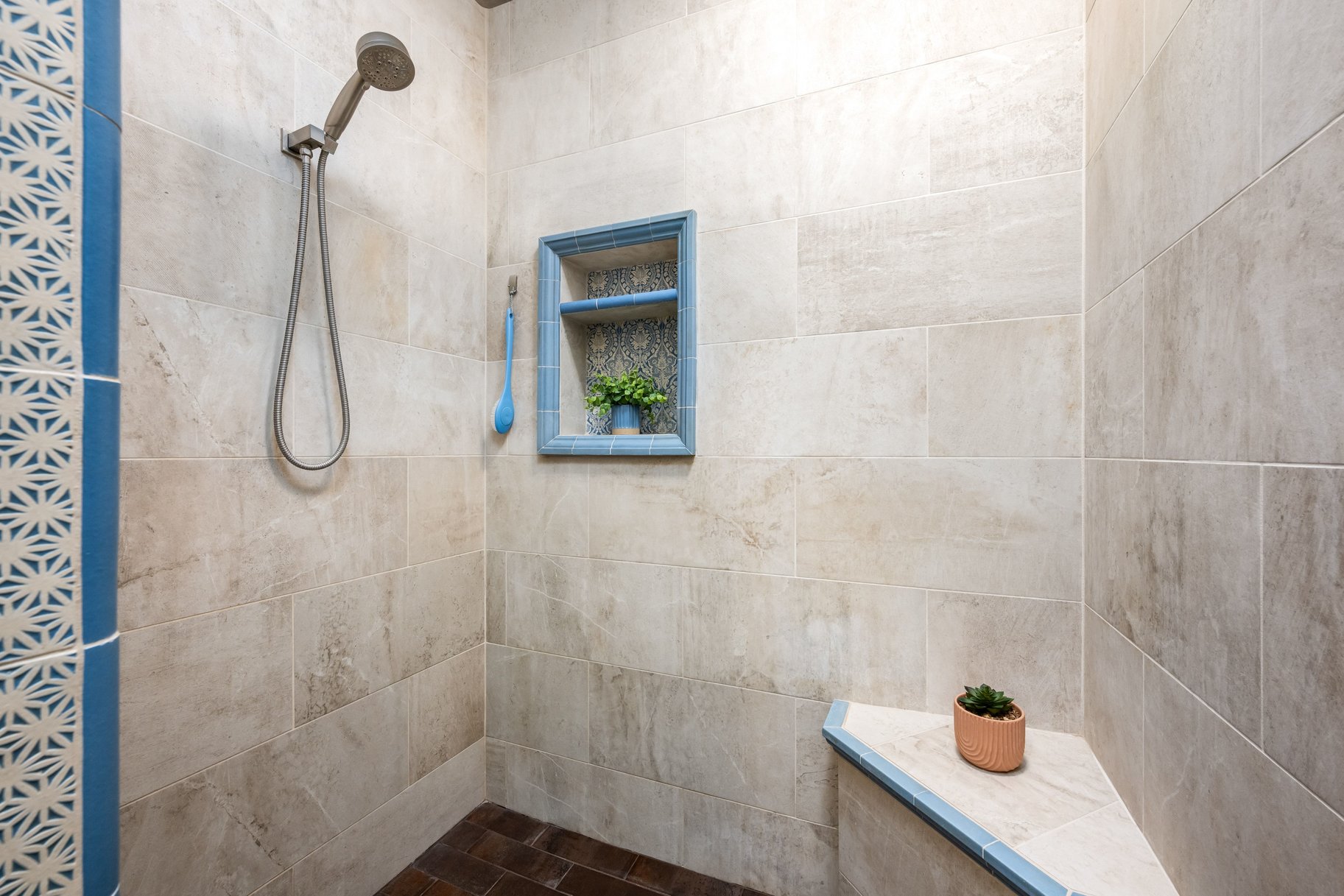 Full bathroom with tiled shower