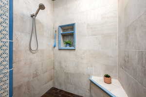 Full bathroom with tiled shower