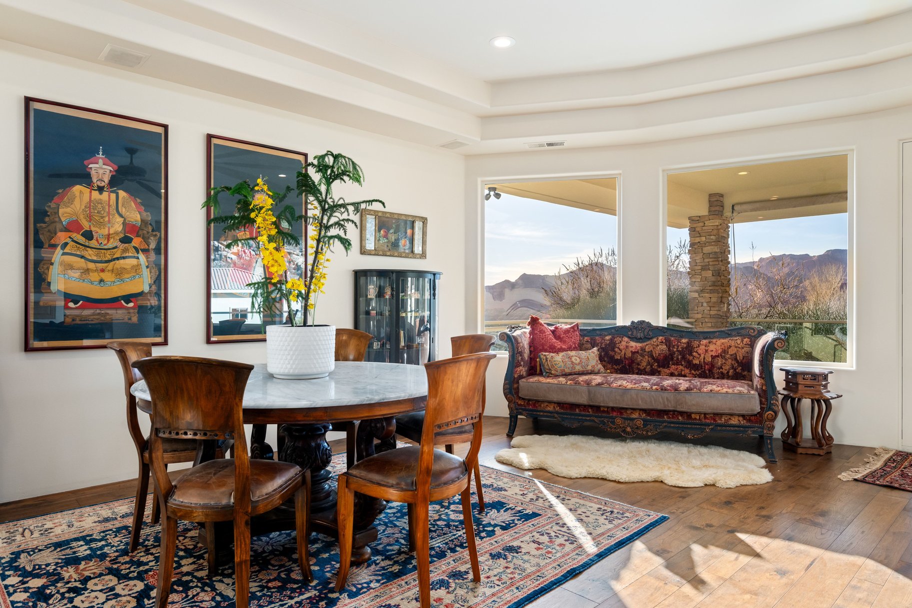 Dining area with wood-type flooring, a mountain view, and recessed lighting